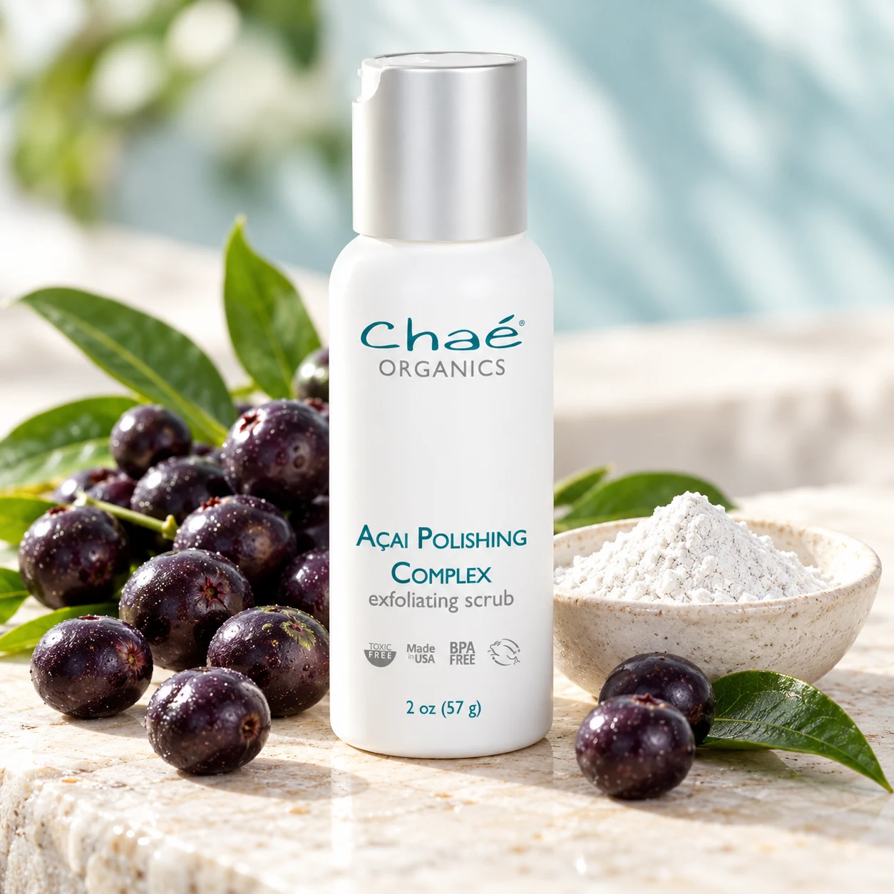 Açai Polishing Complex with fresh dark purple açai berries and a small dish of fine white mineral powder