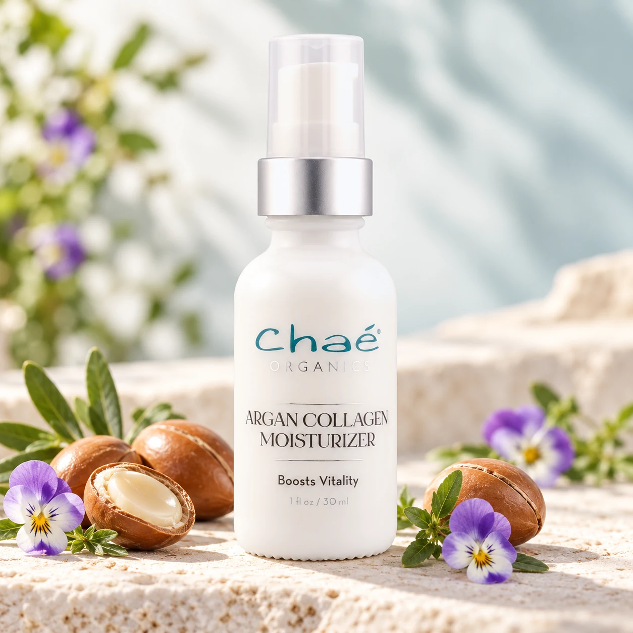 Argan Collagen Moisturizer with a few argan nuts and some small purple wild pansy flowers