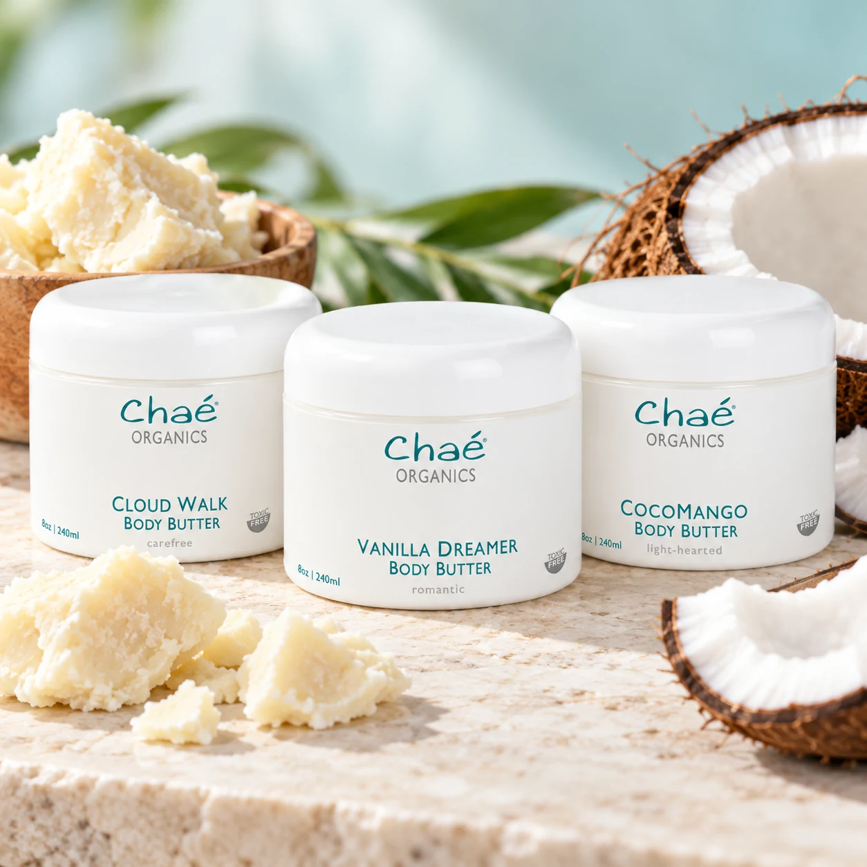 Body Butter with chunks of raw ivory shea butter and a halved coconut