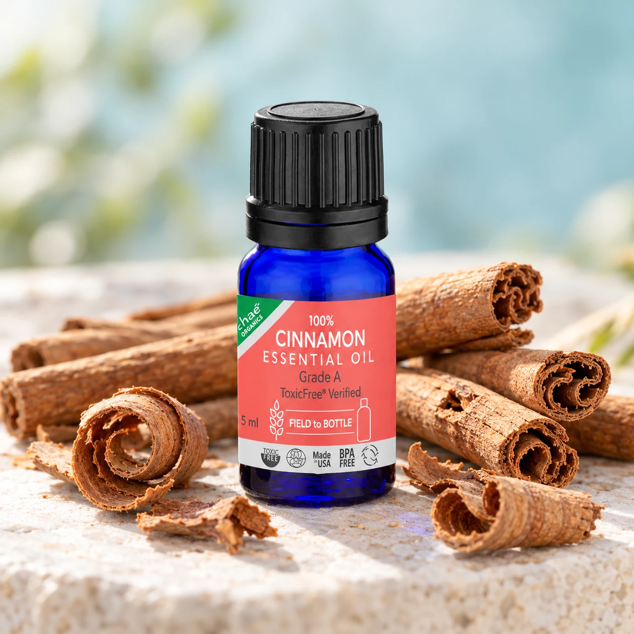 Cinnamon Essential Oil with Ceylon cinnamon sticks and a few curls of cinnamon bark