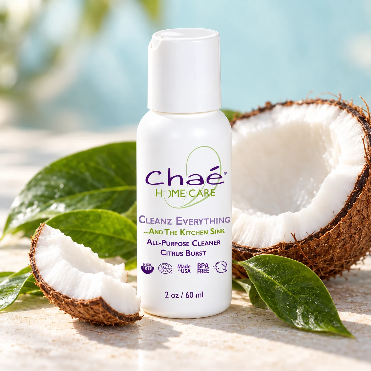 Cleanz Everything Citrus Burst Travel Size with a halved coconut and a few green leaves