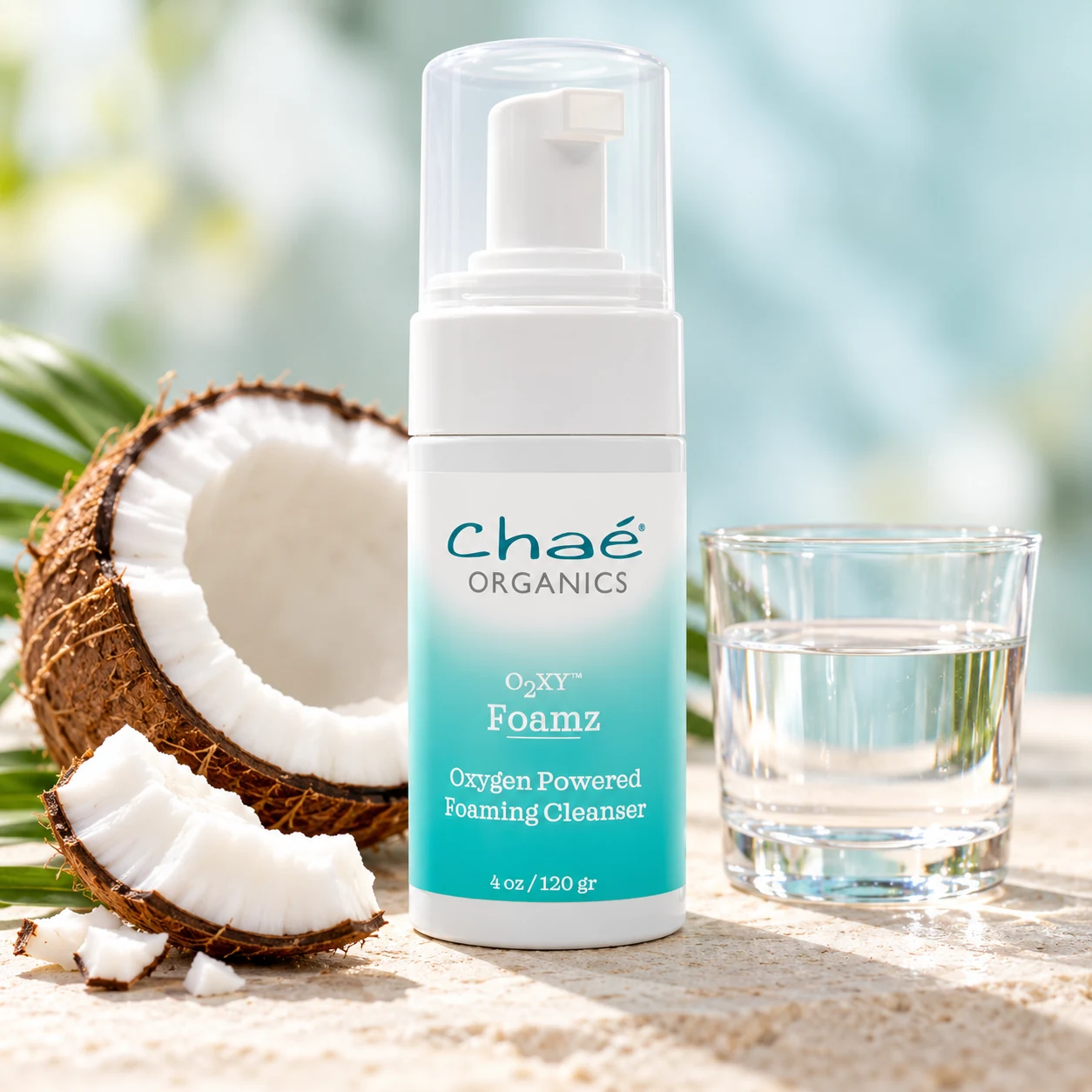 Foamz with a halved coconut and a small glass of clear water