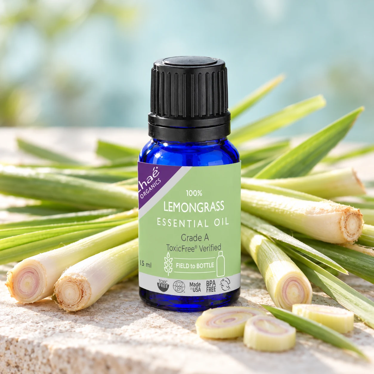 Lemongrass Essential Oil with fresh lemongrass stalks