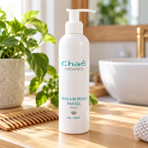 Chaé Move and Be Moved Hair Gel (Flexible) on a wood vanity with a bamboo comb and a green plant
