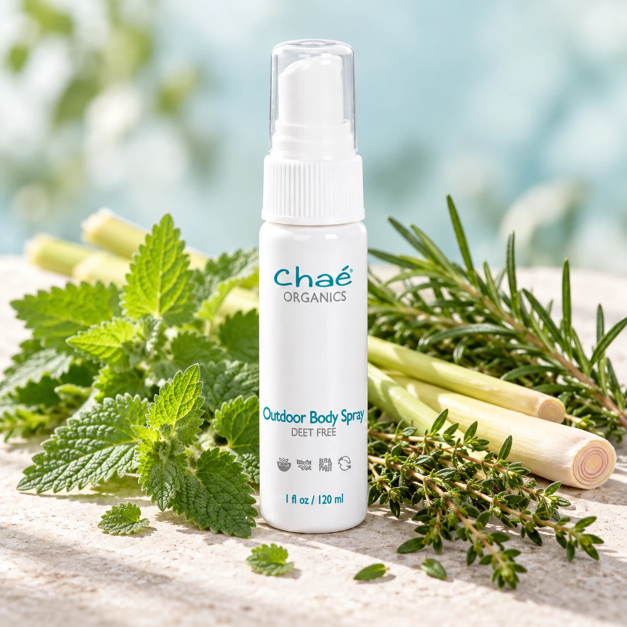 Outdoor Body Spray with fresh catnip leaves, lemongrass stalks and sprigs of rosemary and thyme