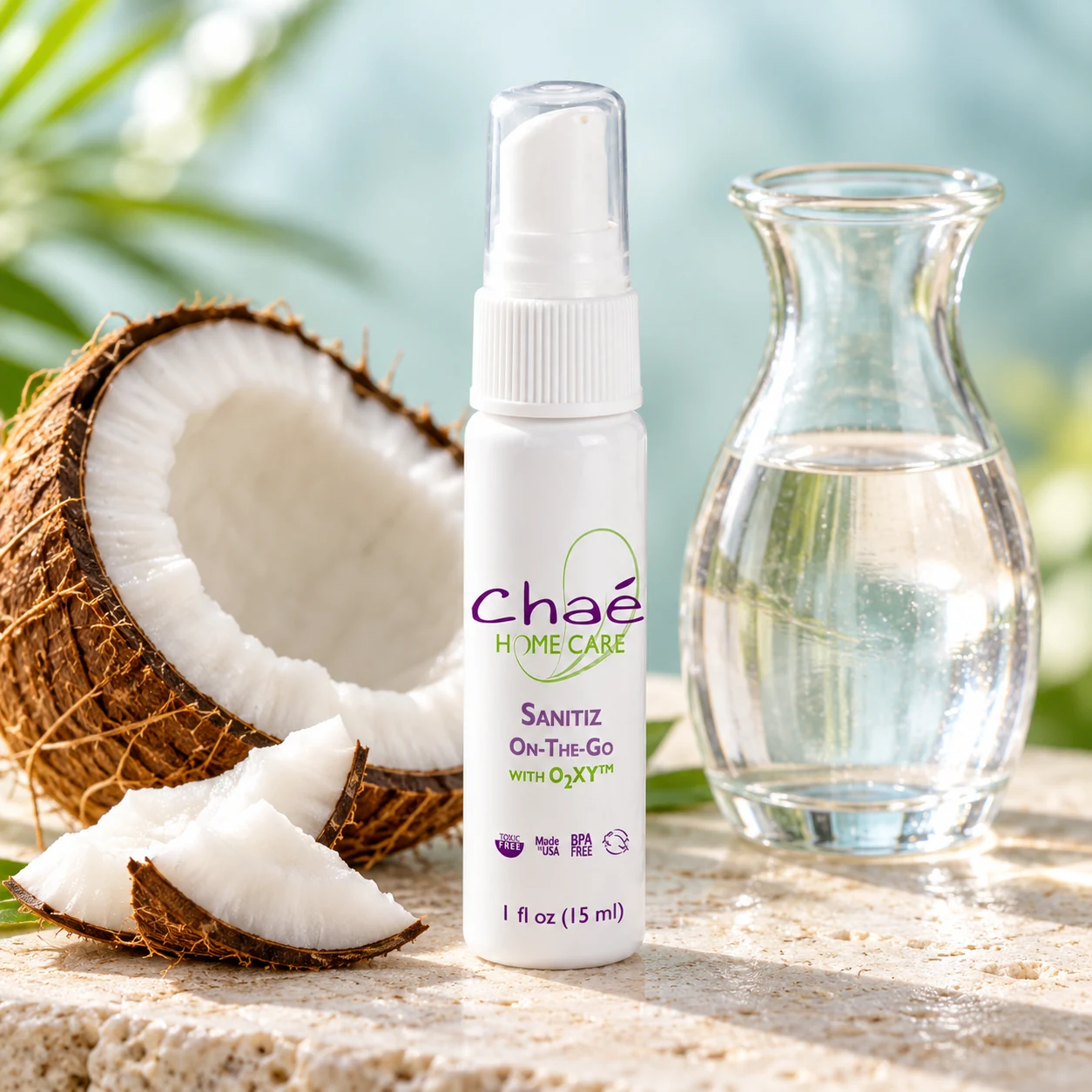 Sanitiz On-The-Go with a halved coconut and a small glass carafe of clear water