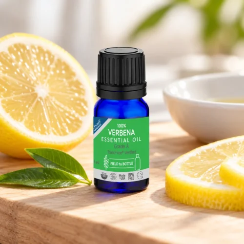 Chaé Verbena Essential Oil on a wooden board with fresh lemon slices